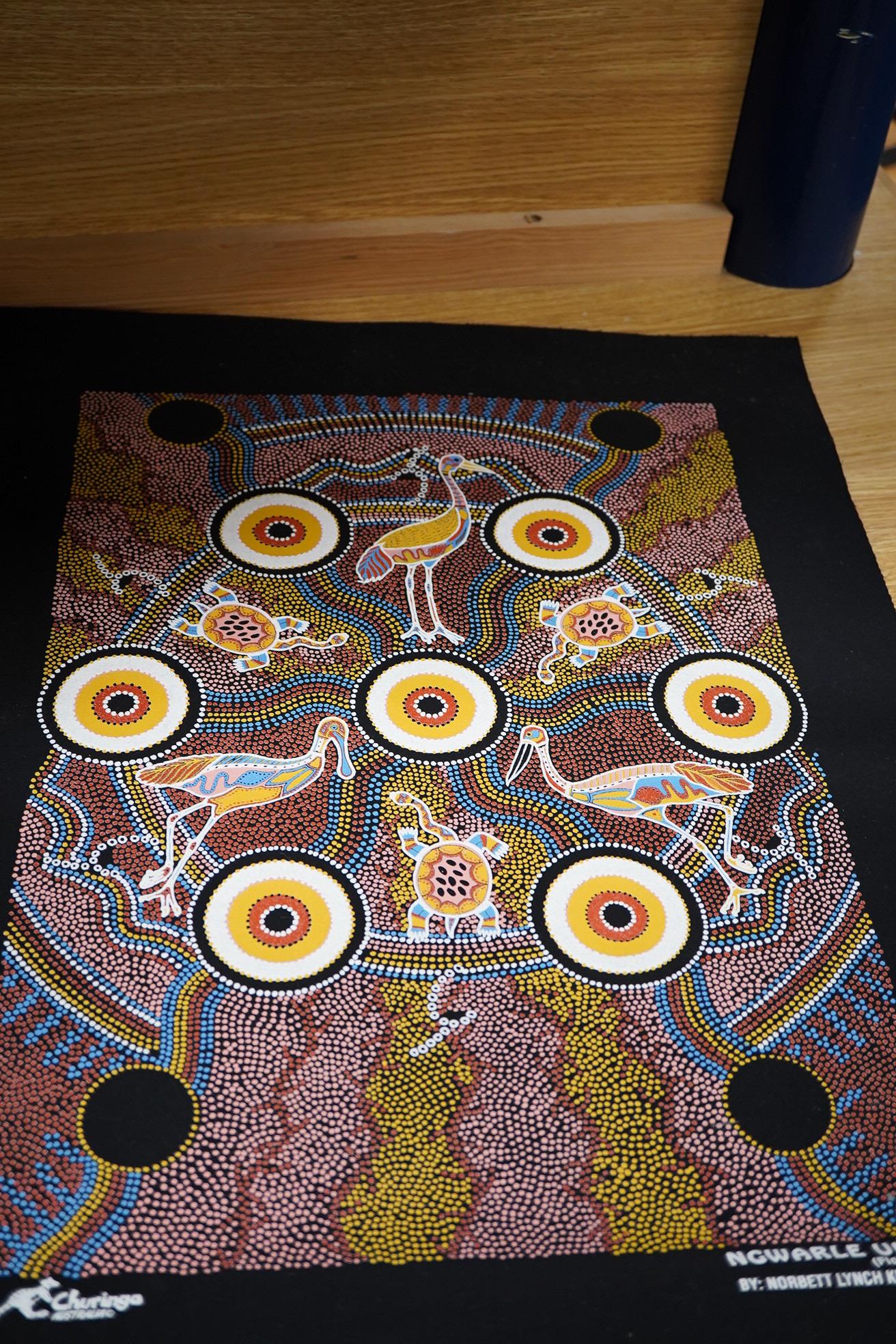 An Aboriginal painted wooden shield and a dot painted scroll